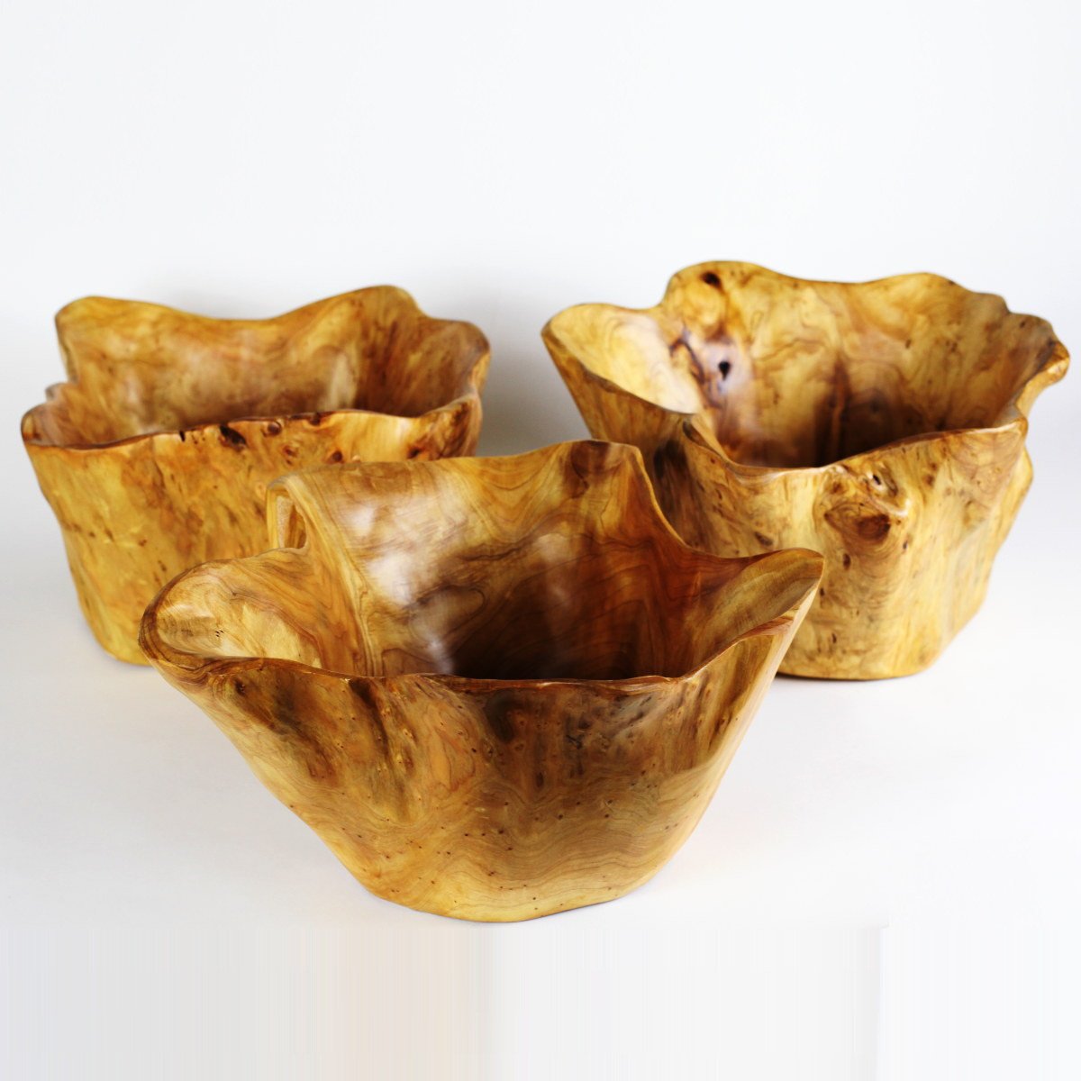FUNCTIONAL ART is the best way to describe Greener Valley's stunning collection of stumps and roots that have been handcrafted into beautiful wine holders, cheese boards, platters, bowls and stools. Handcrafted from the roots and stumps of the Asian Cypress known as Shan Mu. These beautiful stools function equally well as a stool, end table or plant stand. Each piece is absolutely unique. This stool measures 24" high.