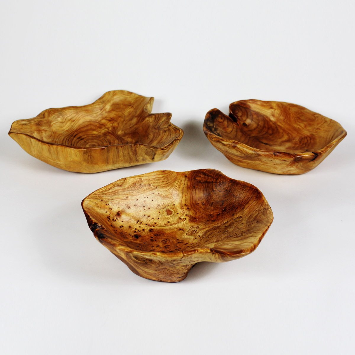FUNCTIONAL ART is the best way to describe Greener Valley's stunning collection of stumps and roots that have been handcrafted into beautiful wine holders, cheese boards, platters, bowls and stools. Handcrafted from the roots and stumps of the Asian Cypress known as Shan Mu. These beautiful stools function equally well as a stool, end table or plant stand. Each piece is absolutely unique. This stool measures 24" high.