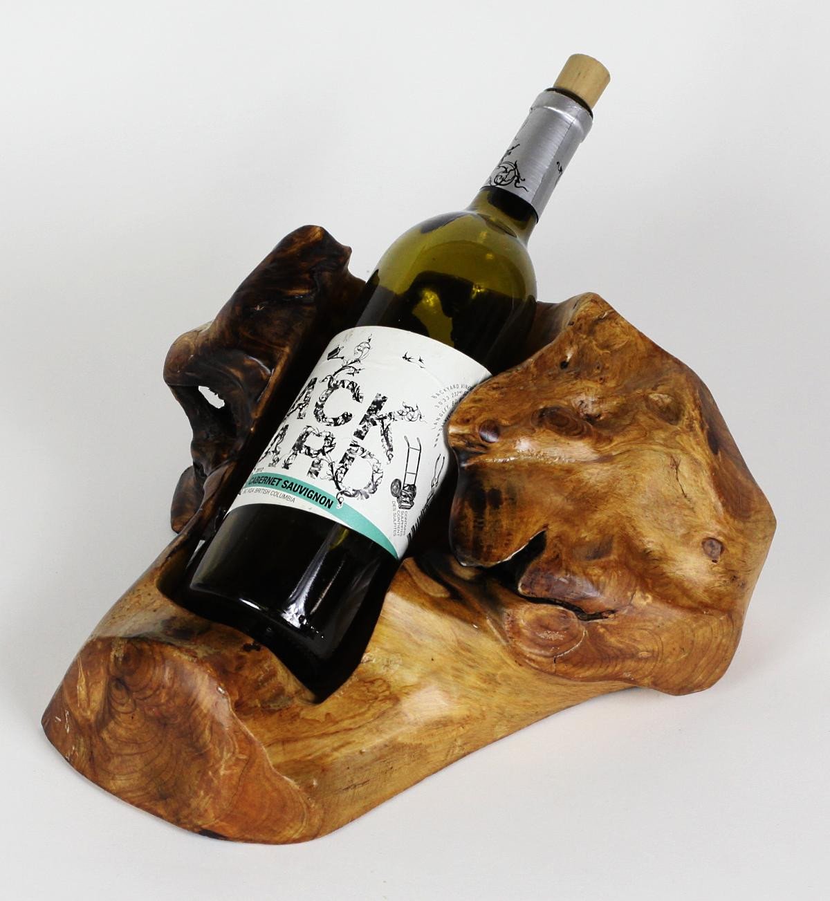 FUNCTIONAL ART is the best way to describe Greener Valley's stunning collection of stumps and roots that have been handcrafted into beautiful wine holders, cheese boards, platters, bowls and stools. Handcrafted from the roots and stumps of the Asian Cypress known as Shan Mu. These beautiful stools function equally well as a stool, end table or plant stand. Each piece is absolutely unique. This stool measures 24" high.