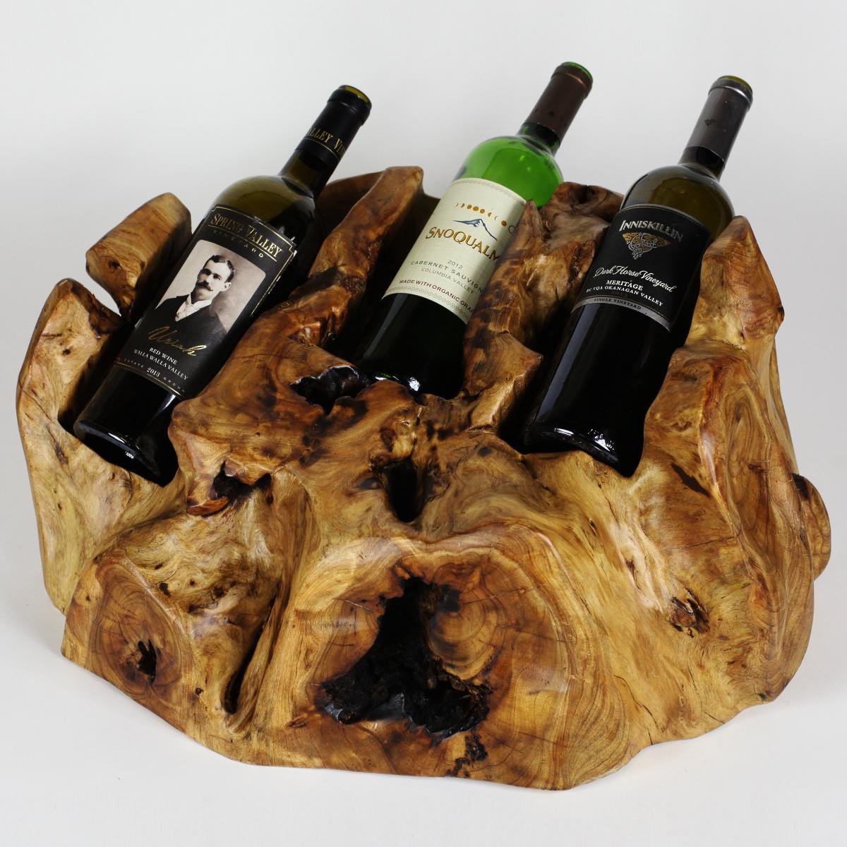 FUNCTIONAL ART is the best way to describe Greener Valley's stunning collection of stumps and roots that have been handcrafted into beautiful wine holders, cheese boards, platters, bowls and stools. Handcrafted from the roots and stumps of the Asian Cypress known as Shan Mu. These beautiful stools function equally well as a stool, end table or plant stand. Each piece is absolutely unique. This stool measures 24" high.