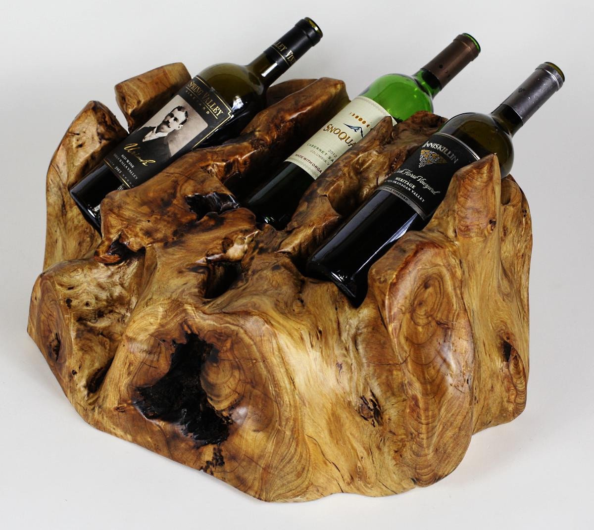 FUNCTIONAL ART is the best way to describe Greener Valley's stunning collection of stumps and roots that have been handcrafted into beautiful wine holders, cheese boards, platters, bowls and stools. Handcrafted from the roots and stumps of the Asian Cypress known as Shan Mu. These beautiful stools function equally well as a stool, end table or plant stand. Each piece is absolutely unique. This stool measures 24" high.