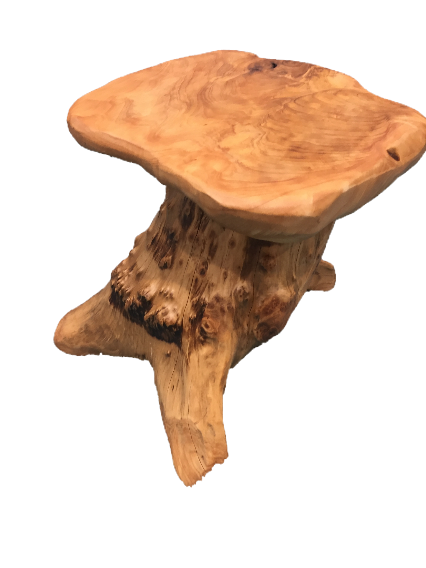 FUNCTIONAL ART is the best way to describe Greener Valley's stunning collection of stumps and roots that have been handcrafted into beautiful wine holders, cheese boards, platters, bowls and stools. Handcrafted from the roots and stumps of the Asian Cypress known as Shan Mu. These beautiful stools function equally well as a stool, end table or plant stand. Each piece is absolutely unique. This stool measures 24" high.
