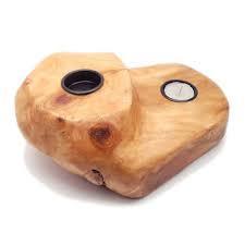 FUNCTIONAL ART is the best way to describe Greener Valley's stunning collection of stumps and roots that have been handcrafted into beautiful wine holders, cheese boards, platters, bowls and stools. Handcrafted from the roots and stumps of the Asian Cypress known as Shan Mu. These beautiful stools function equally well as a stool, end table or plant stand. Each piece is absolutely unique. This stool measures 24" high.