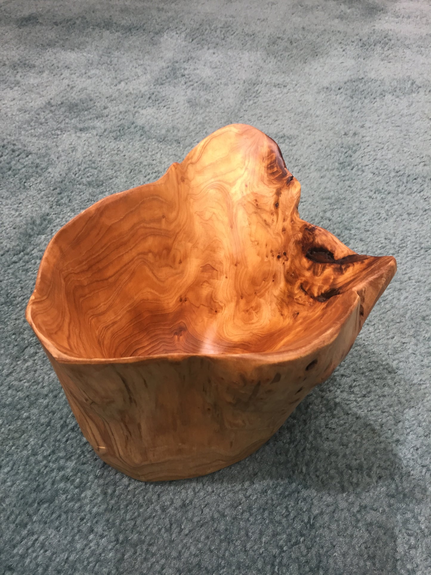 FUNCTIONAL ART is the best way to describe Greener Valley's stunning collection of stumps and roots that have been handcrafted into beautiful wine holders, cheese boards, platters, bowls and stools. Handcrafted from the roots and stumps of the Asian Cypress known as Shan Mu. These beautiful stools function equally well as a stool, end table or plant stand. Each piece is absolutely unique. This stool measures 24" high.