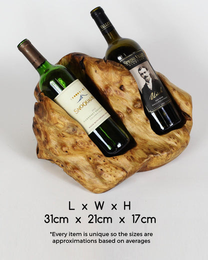 FUNCTIONAL ART is the best way to describe Greener Valley's stunning collection of stumps and roots that have been handcrafted into beautiful wine holders, cheese boards, platters, bowls and stools. Handcrafted from the roots and stumps of the Asian Cypress known as Shan Mu. These beautiful stools function equally well as a stool, end table or plant stand. Each piece is absolutely unique. This stool measures 24" high.